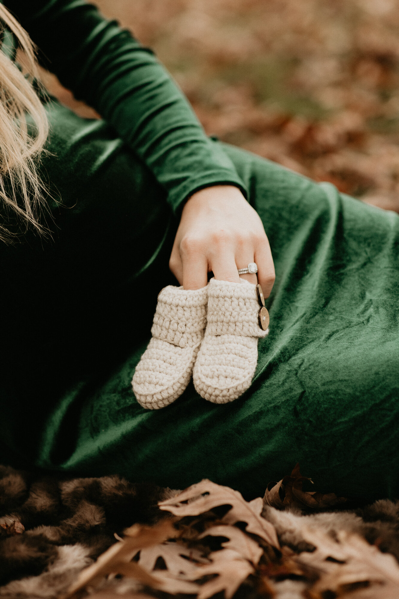 Close up of newborn baby's tiny knit booties, in-home newborn photography by The Indi Collective